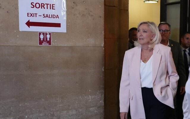 Far-right leader Marine Le Pen arrives at the courtroom for the verdict of her appeals trial, in Paris, France, July 7, 2026. (AP Photo/Aurelien Morissard)
