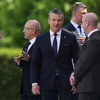 United States Defense Secretary Pete Hegseth, center, speaks with White House Chief of Staff Stephen Miller at the Bestepe Presidential Palace in Ankara, Turkey, July 7, 2026. (AP Photo/Francisco Seco)