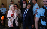 Far-right leader Marine Le Pen leaves the courtroom after the verdict of her appeal trial, in Paris, France, July. 7, 2026. (AP Photo/Aurelien Morissard)