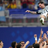Argentina players toss teammate Lionel Messi into the air as they celebrate after winning the World Cup round of 16 soccer match against Egypt in Atlanta, Georgia, July 7, 2026. (AP Photo/Jacob Kupferman)