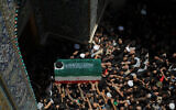The coffin of the late Iranian supreme leader Ayatollah Ali Khamenei is carried by mourners to the Imam Ali Shrine in Najaf, Iraq, on July 8, 2026. (AP Photo/ Anmar Khalil)