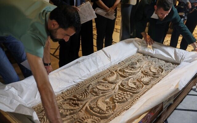 Museum employees unpack a carved stone panel after Syrian authorities unveiled antiquities returned from France at the National Museum in Damascus, Syria, July 8, 2026.(AP/Ghaith Alsayed) Museum employees unpack a carved stone panel after Syrian authorities unveiled antiquities returned from France at the National Museum in Damascus, Syria, July 8, 2026.(AP/Ghaith Alsayed)
