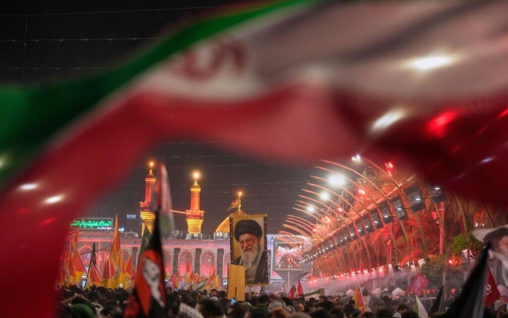 Mourners wait for the arrival of the funeral procession of slain Iranian supreme leader Ali Khamenei outside the Imam Hussein Shrine in Karbala, Iraq, July 8, 2026. (AP Photo/Khalil Hamra)