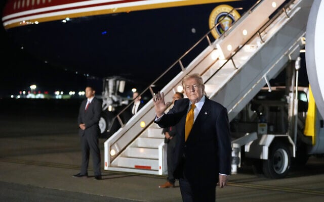 US President Donald Trump waves as he switches planes at US Air Force Base, RAF Mildenhall in Suffolk Eastern England, on his way back to Washington from the NATO summit in Ankara, Turkey, July 8, 2026. (AP Photo/Alex Brandon)