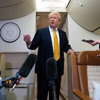 US President Donald Trump speaks with reporters in flight on Air Force One after landing at US Air Force Base at RAF Mildenhall, in Suffolk, Eastern England, July 8, 2026. (AP/Alex Brandon)