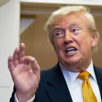 US President Donald Trump speaks with reporters in flight on Air Force One after landing at US Air Force Base at RAF Mildenhall, in Suffolk Eastern England, July 8, 2026. (AP Photo/Alex Brandon)