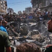 Palestinians gather around a car hit in an Israeli military strike that, according to Hamas-run health authorities, killed at least one person in Gaza City, July 9, 2026. (AP/Jehad Alshrafi) Palestinians gather around a car hit in an Israeli military strike that, according to Hamas-run health authorities, killed at least one person in Gaza City, July 9, 2026. (AP/Jehad Alshrafi)