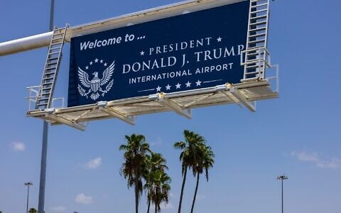 A sign displaying the name of the rebranded Donald J. Trump International Airport in West Palm Beach, Fla., is seen Thursday, July 9, 2026. (AP Photo/Saul Martinez)