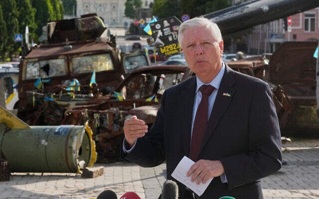 US Sen. Lindsey Graham, a South Carolina Republican, answers questions from the media near an exhibition of damaged Russian vehicles in central Kyiv, Ukraine, on July 10, 2026. (AP Photo/Efrem Lukatsky)