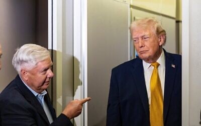 Sen. Lindsey Graham, left, gestures as US President Donald Trump speaks with reporters while in flight on Air Force One, on January 4, 2026, as they were returning to Joint Base Andrews, Maryland (AP Photo/Alex Brandon, File)