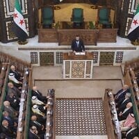 Syrian President Ahmad al-Sharaa addresses the inaugural session of Syria’s newly formed People’s Assembly, the first since the fall of President Bashar Assad’s government, in Damascus, Syria on Sunday, July 12, 2026. (AP Photo/Ghaith Alsayed)