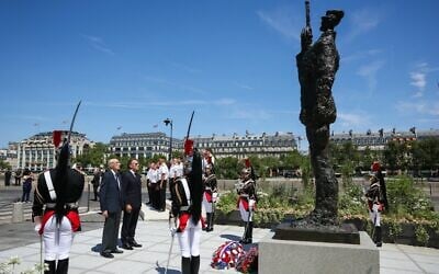 France's President Emmanuel Macron, center right, with Charles Dreyfus, grandson of Alfred Dreyfus, during a tribute ceremony to Captain Alfred Dreyfus, on the Ile de la Cite near the Court of Cassation in Paris, France, July 12, 2026. (Thomas Samson/Pool Photo via AP) France's President Emmanuel Macron, center right, with Charles Dreyfus, grandson of Alfred Dreyfus, during a tribute ceremony to Captain Alfred Dreyfus, on the Ile de la Cite near the Court of Cassation in Paris, France, July 12, 2026. (Thomas Samson/Pool Photo via AP)