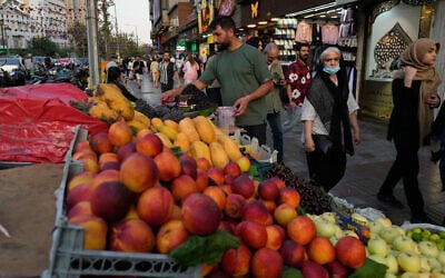 A fruit seller arranges fruits at his stall at Tajrish square in northern Tehran, Iran, July 13, 2026. (AP Photo/Vahid Salemi) A fruit seller arranges fruits at his stall at Tajrish square in northern Tehran, Iran, July 13, 2026. (AP Photo/Vahid Salemi)