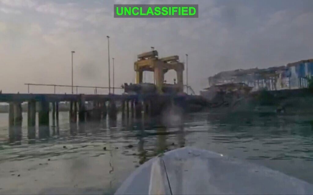 This image from video released by US Central Command, shows a view from a Corsair unmanned surface vessel, also called one-way attack surface drone, fired by US military, closing in on Bandar Abbas Naval Base, Iran, July 12, 2026. (US Central Command via AP)