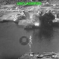 This image from video released by US Central Command shows an explosion at Bandar Abbas Naval Base, Iran, as three Corsair unmanned surface vessels, also called one-way attack surface drones, fired by the US military, hit the port July 12, 2026. (US Central Command via AP)