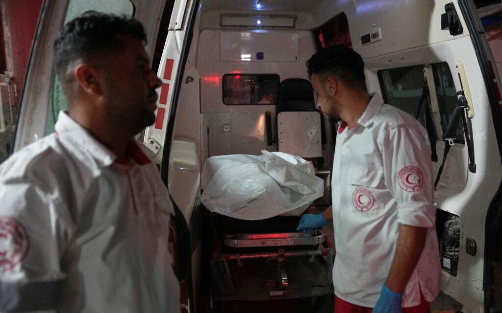Palestinian paramedics arrive at Al-Aqsa Hospital with the body of a person killed in an Israeli military strike on a residential building in Deir al-Balah, central Gaza Strip, July 15, 2026. A military official said the strike targeted a Hamas operative. (AP/Abdel Kareem Hana) Palestinian paramedics arrive at Al-Aqsa Hospital with the body of a person killed in an Israeli military strike on a residential building in Deir al-Balah, central Gaza Strip, July 15, 2026. A military official said the strike targeted a Hamas operative. (AP/Abdel Kareem Hana)