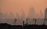 The New York City skyline is seen through a cover of wildfire smoke, in Jersey City, New Jersey, July 17, 2026. (AP/Ryan Murphy)