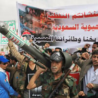 Houthi supporters hold a rally in Sanaa, Yemen, July 17, 2026, against the Saudi-led coalition. The banner in Arabic reads, "All Saudi oil facilities are targets to our missiles and drones." (AP Photo/Osamah Abdulrahman)