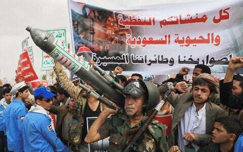 Houthi supporters hold a rally in Sanaa, Yemen, July 17, 2026, against the Saudi-led coalition. The banner in Arabic reads, "All Saudi oil facilities are targets to our missiles and drones." (AP Photo/Osamah Abdulrahman)