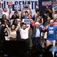 From left foreground, Michigan state Rep. Donavan McKinney, US Rep. Alexandria Ocasio-Cortez, Michigan Democratic US Senate primary candidate Abdul El-Sayed, US Sen. Bernie Sanders, United Auto Workers President Shawn Fain, and US Rep. Rashida Tlaib, join hands following a campaign rally for El-Sayed, July 18, 2026, in Detroit. (AP Photo/Jose Juarez)