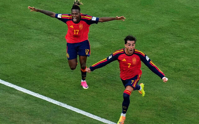 Spain’s Ferran Torres (front right) celebrates after scoring the winning goal in the World Cup final soccer match between Spain and Argentina in East Rutherford, N.J., near New York, July 19, 2026.  At left is Nico Williams, who head down the ball for Torres to score. (AP Photo/Seth Wenig)