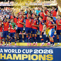 Spain’s team captain Rodri lifts the trophy after Spain won the World Cup final against Argentina in East Rutherford, N.J., near New York, July 19, 2026. (AP Photo/Ashley Landis)