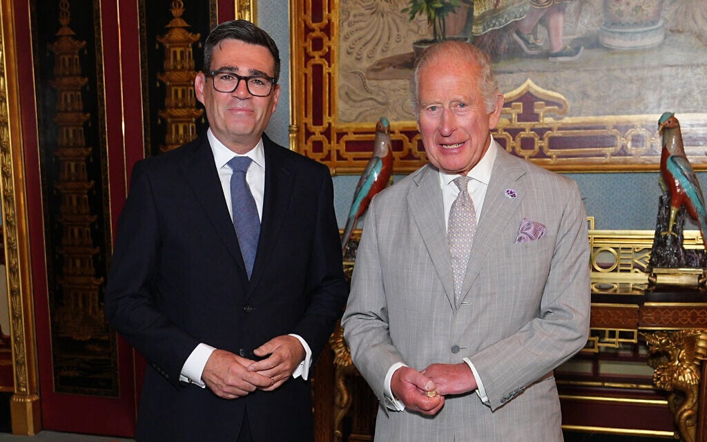 Britain's King Charles III welcomes Andy Burnham, left, during an audience at Buckingham Palace, London, where he invited the leader of the Labour Party to become Prime Minister and form a new government, July 20, 2026. (Aaron Chown/Pool Photo via AP)