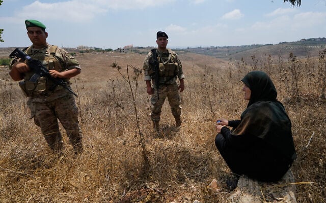 Lebanese army soldiers stand near a woman after preventing her from entering the southern village of Zawtar Al Gharbieh, Lebanon, July 22, 2026. (AP Photo/Mohammed Zaatari) Lebanese army soldiers stand near a woman after preventing her from entering the southern village of Zawtar Al Gharbieh, Lebanon, July 22, 2026. (AP Photo/Mohammed Zaatari)