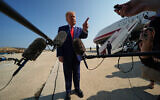 US President Donald Trump speaks to reporters before boarding Air Force One, July 22, 2026, at Joint Base Andrews, Maryland. (AP Photo/Julia Demaree Nikhinson)