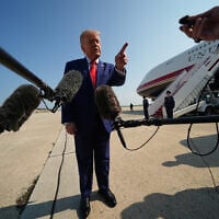 US President Donald Trump speaks to reporters before boarding Air Force One, July 22, 2026, at Joint Base Andrews, Maryland. (AP Photo/Julia Demaree Nikhinson)