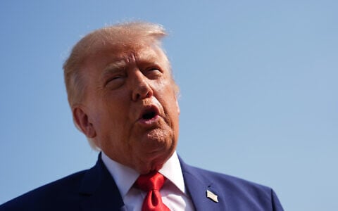 US President Donald Trump speaks to reporters before boarding Air Force One, July 22, 2026, at Joint Base Andrews, Maryland. (AP/Julia Demaree Nikhinson)