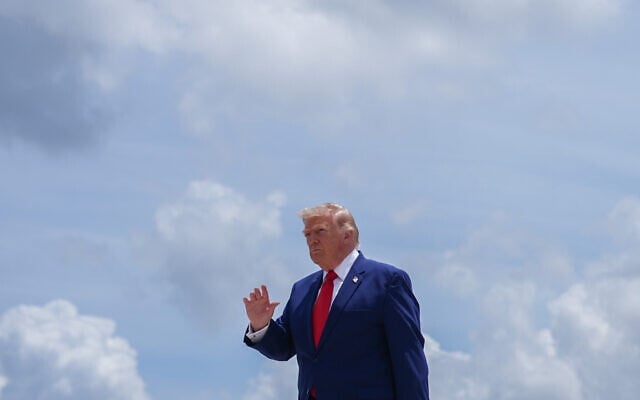 US President Donald Trump waves to reporters after arriving on Air Force One at Dobbins Air Reserve Base, July 22, 2026, in Marietta, Georgia. (AP/Julia Demaree Nikhinson)