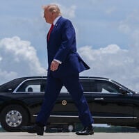 US President Donald Trump walks to the presidential limousine, known as The Beast, after arriving on Air Force One at Dobbins Air Reserve Base, July 22, 2026, in Marietta, Georgia. (AP Photo/Julia Demaree Nikhinson)