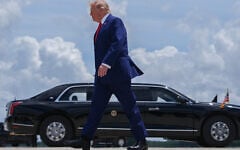 US President Donald Trump walks to the presidential limousine, known as The Beast, after arriving on Air Force One at Dobbins Air Reserve Base, July 22, 2026, in Marietta, Georgia. (AP Photo/Julia Demaree Nikhinson)