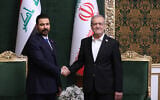 In this photo released by the Iranian Presidency Office, Iranian President Masoud Pezeshkian, right, shakes hands with Iraq’s Prime Minister Ali al-Zaidi during their meeting in Tehran, Iran, July 22, 2026. (Iranian Presidency Office via AP)