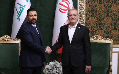Iraqi Prime Minister Ali al-Zaidi, left, shakes hands with Iranian President Masoud Pezeshkian during their meeting in Tehran, Iran, July 22, 2026. (Iranian Presidency Office via AP) Iraqi Prime Minister Ali al-Zaidi, left, shakes hands with Iranian President Masoud Pezeshkian during their meeting in Tehran, Iran, July 22, 2026. (Iranian Presidency Office via AP)