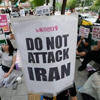 Members of the People in Solidarity with Palestinians stage a rally denouncing the US attacks on Iran in Seoul, South Korea, July 25, 2026. (AP Photo/Ahn Young-joon)