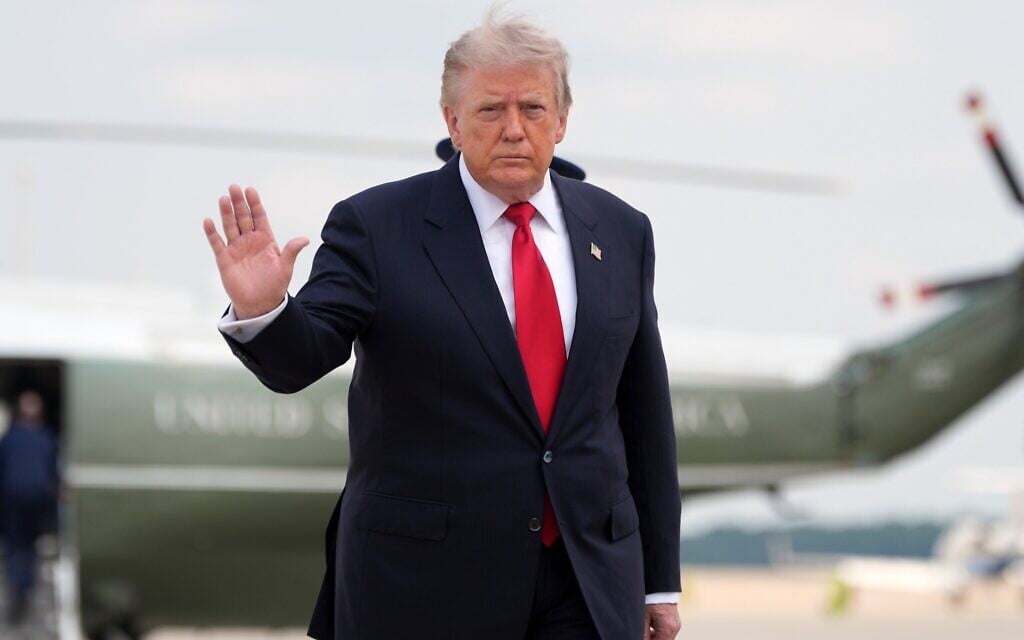 US President Donald Trump waves as he walks from Marine One to board Air Force One, July 27, 2026, at Joint Base Andrews, Maryland. (AP Photo/Alex Brandon)