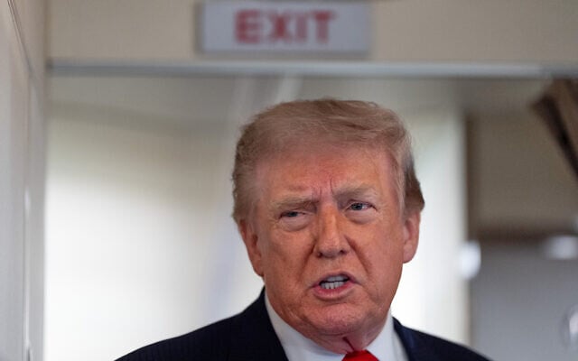 US President Donald  Trump speaks with reporters while on Air Force One en route to Oakland County International Airport, July 27, 2026, in Waterford Township, Mich. (AP  Photo/Alex Brandon)