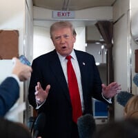 US President Donald Trump speaks with reporters while on Air Force One en route to Oakland County International Airport, July 27, 2026, in Waterford Township, Mich. (AP Photo/ Alex Brandon)