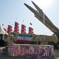 Iranian missiles are displayed by the armed forces as an anti-Trump banner declaring in English and Farsi, 'We will kill you,' is seen in a temporary exhibition at Azadi (Freedom) Square in Tehran, Iran, July 29, 2026. (AP Photo/Vahid Salemi)