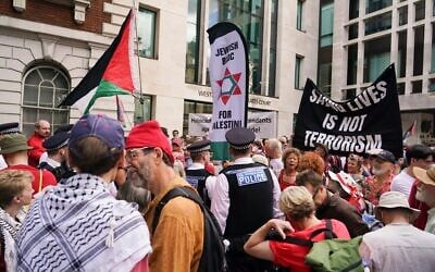 Demonstrators gather outside the Westminster Magistrates Court in London, July 30, 2026, as a plea hearing for 25 people accused of showing support for Palestine Action takes place. (AP/Alberto Pezzali)