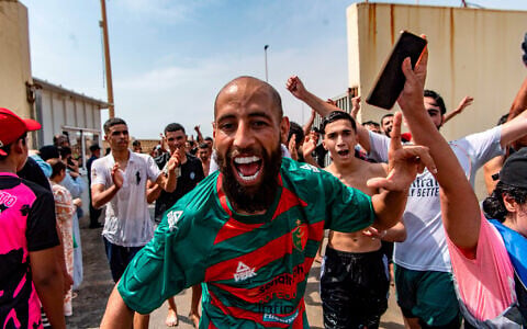 Migrants cross from Morocco into the Spanish enclave of Ceuta, July 30, 2026. (AP Photo/Antonio Sempere)