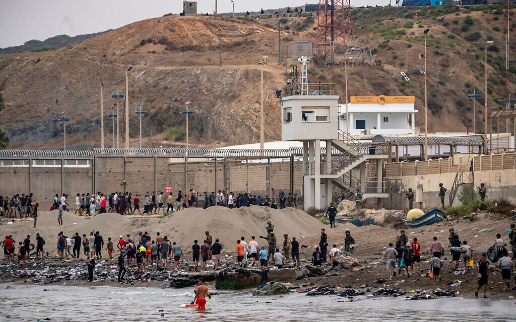 Migrants return to Morocco from the Spanish enclave of Ceuta, July 31, 2026. (AP Photo/Antonio Sempere)