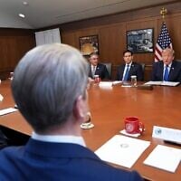 US President Donald Trump speaks, joined by Defense Secretary Pete Hegseth, right, Secretary of State Marco Rubio, from third left, Interior Secretary Doug Burgum, and from bottom row left, Vice President JD Vance and Treasury Secretary Scott Bessent, speaks during a cabinet meeting, July 31, 2026, at Camp David, the presidential retreat, near Thurmont, Maryland, July 31, 2026. (AP Photo/Jacquelyn Martin)