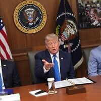 US President Donald Trump speaks as Secretary of State Marco Rubio, left, and Defense Secretary Pete Hegseth listen during a cabinet meeting, July 31, 2026, at Camp David, the presidential retreat, near Thurmont, Maryland, July 31, 2026. (AP Photo/Jacquelyn Martin)