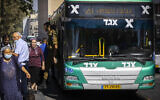 Illustrative: Passengers exit an Egged bus outside the Jerusalem central bus station, on August 1, 2022. (Olivier Fitoussi/Flash90)