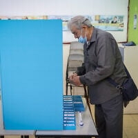 Illustrative: A man votes during Israel's Knesset election in Safed, northern Israel, on November 1, 2022. (David Cohen/Flash90)