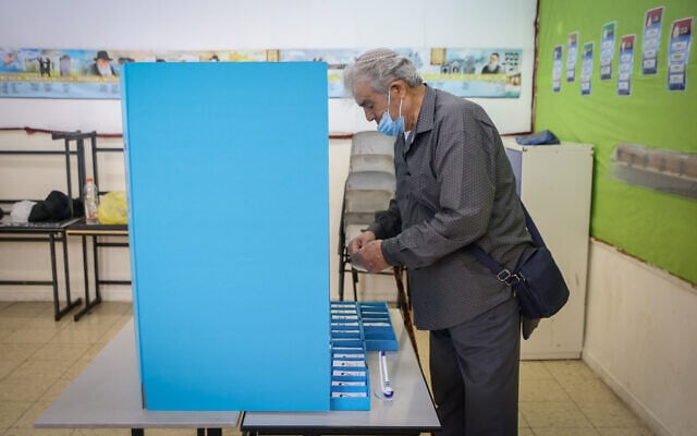 Illustrative: A man votes during Israel's Knesset election in Safed, northern Israel, on November 1, 2022. (David Cohen/Flash90) Illustrative: A man votes during Israel's Knesset election in Safed, northern Israel, on November 1, 2022. (David Cohen/Flash90)