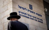 Illustrative: A man outside the Chief Rabbinate headquarters in Jerusalem, October 31, 2024. (Chaim Goldberg/Flash90)